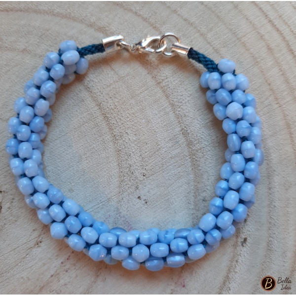 Braccialetto Kumihimo in perline ovaline azzurre di vetro lumè con chiusura argentata