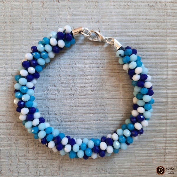 Braccialetto Kumihimo in perline mix blue vetro sfaccettato con chiusura argentata
